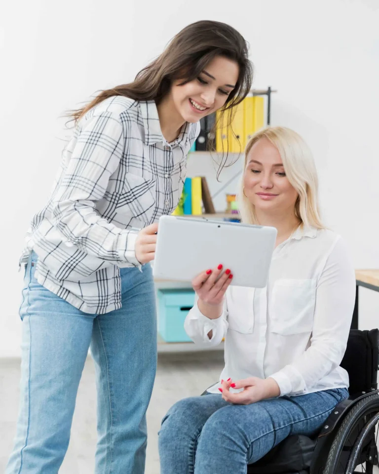 front-view-woman-wheelchair-holding-tablet (1)